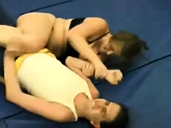 Chubby female wrestler shows her tricks to a skinny guy