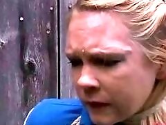 Hot blonde roped to a wood fence begs mercy BDSM