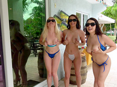 Passionate women are having a wild time by the pool