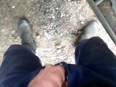 Lad taking a piss in gumboots pov