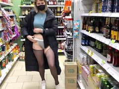 In the store tears pantyhose and shows pussy!