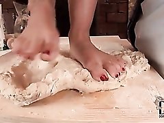 Ladies rub their feet in food for fun