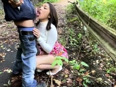Provoking Asian babe gives a perfect blowjob in the outdoors